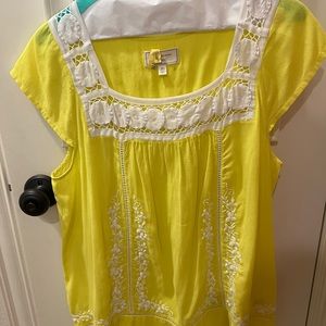 Fun yellow top with white floral details from Anthropologie.